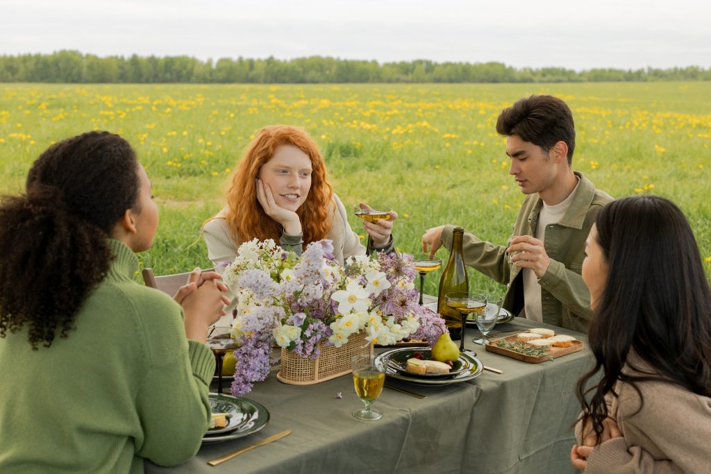 Group of friend eating in a field